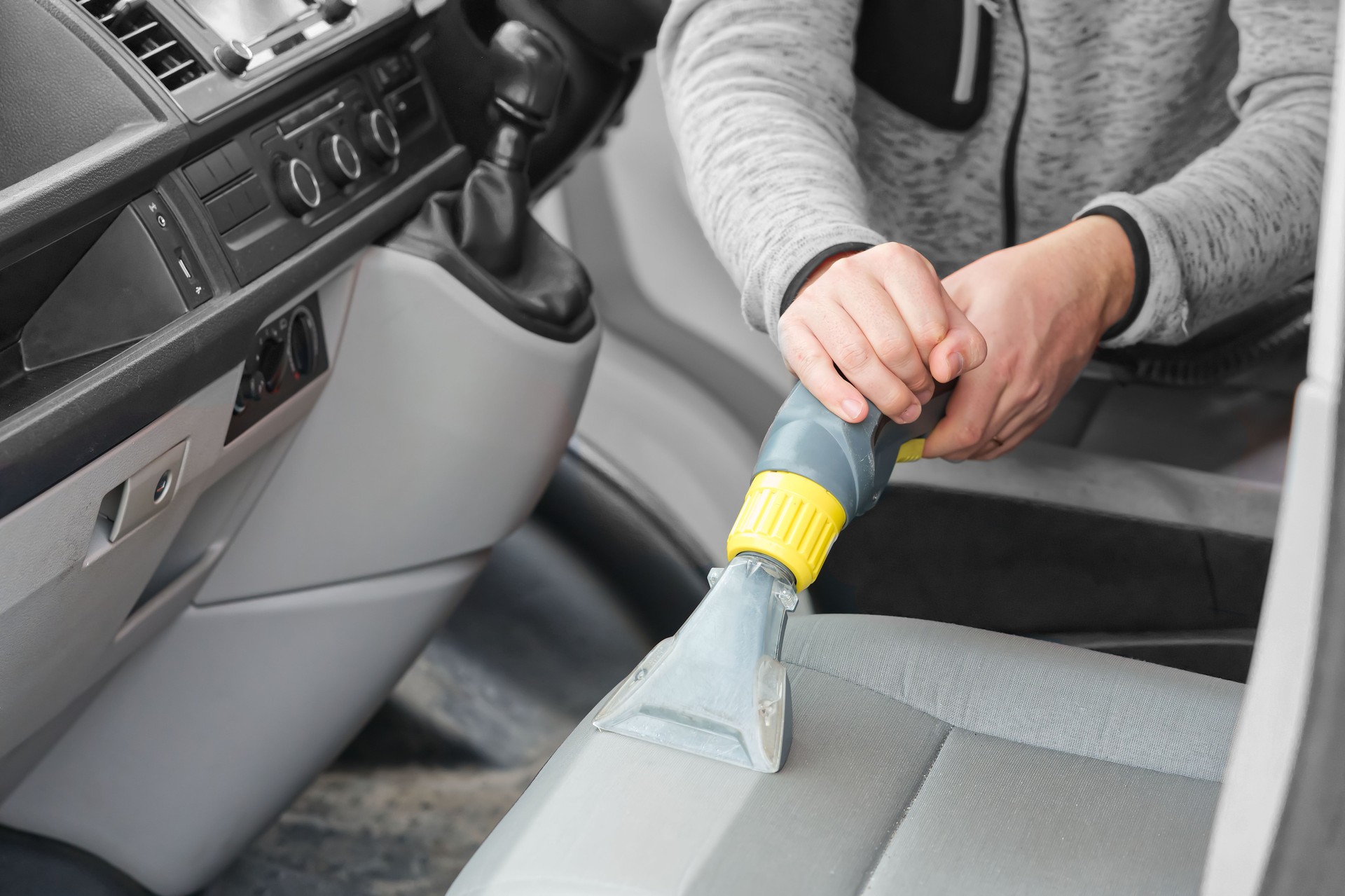 car dry cleaning. Light gray textile seats chemical cleaning with professionally extraction method.