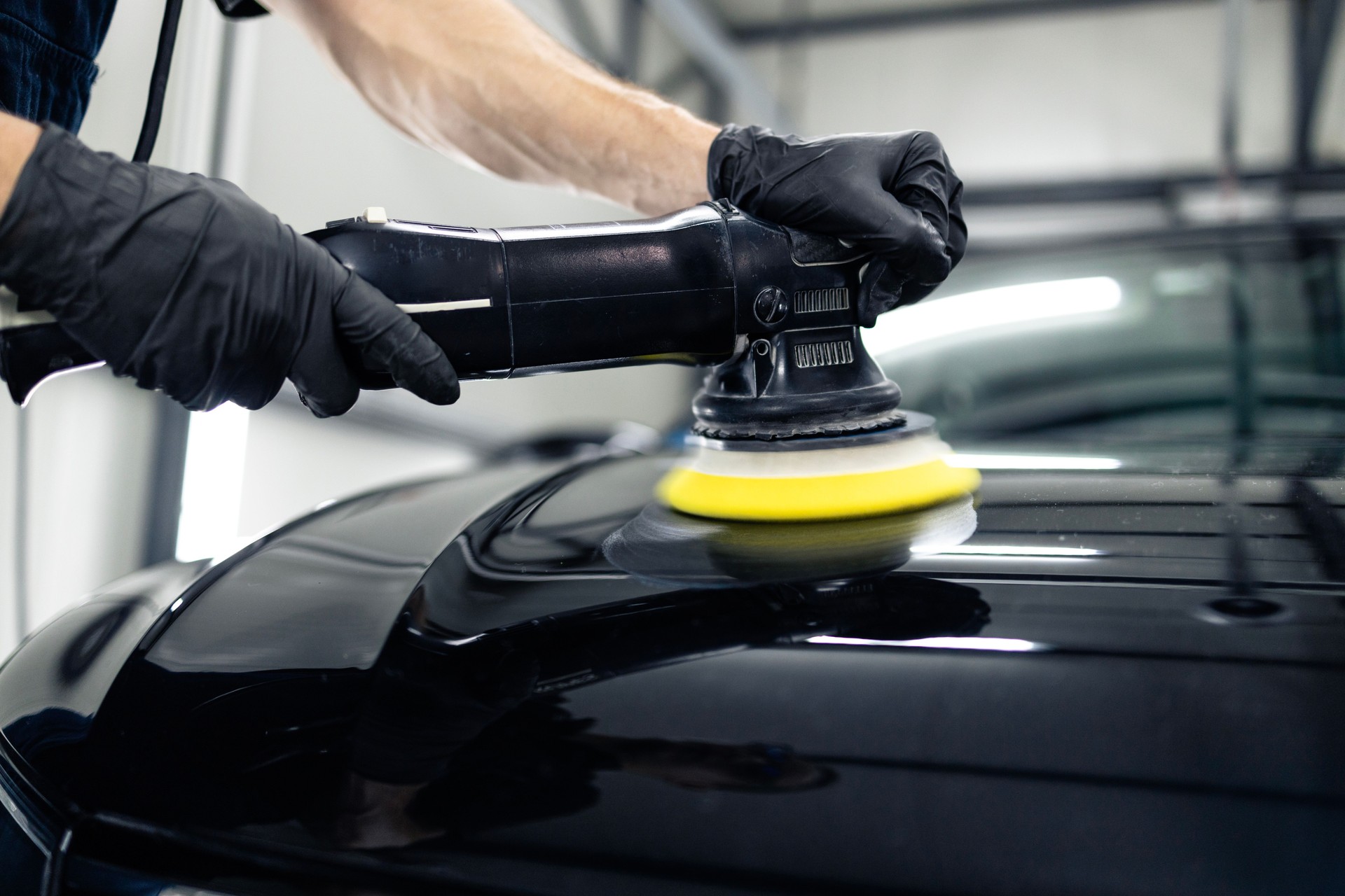 Professional polishing car hood.