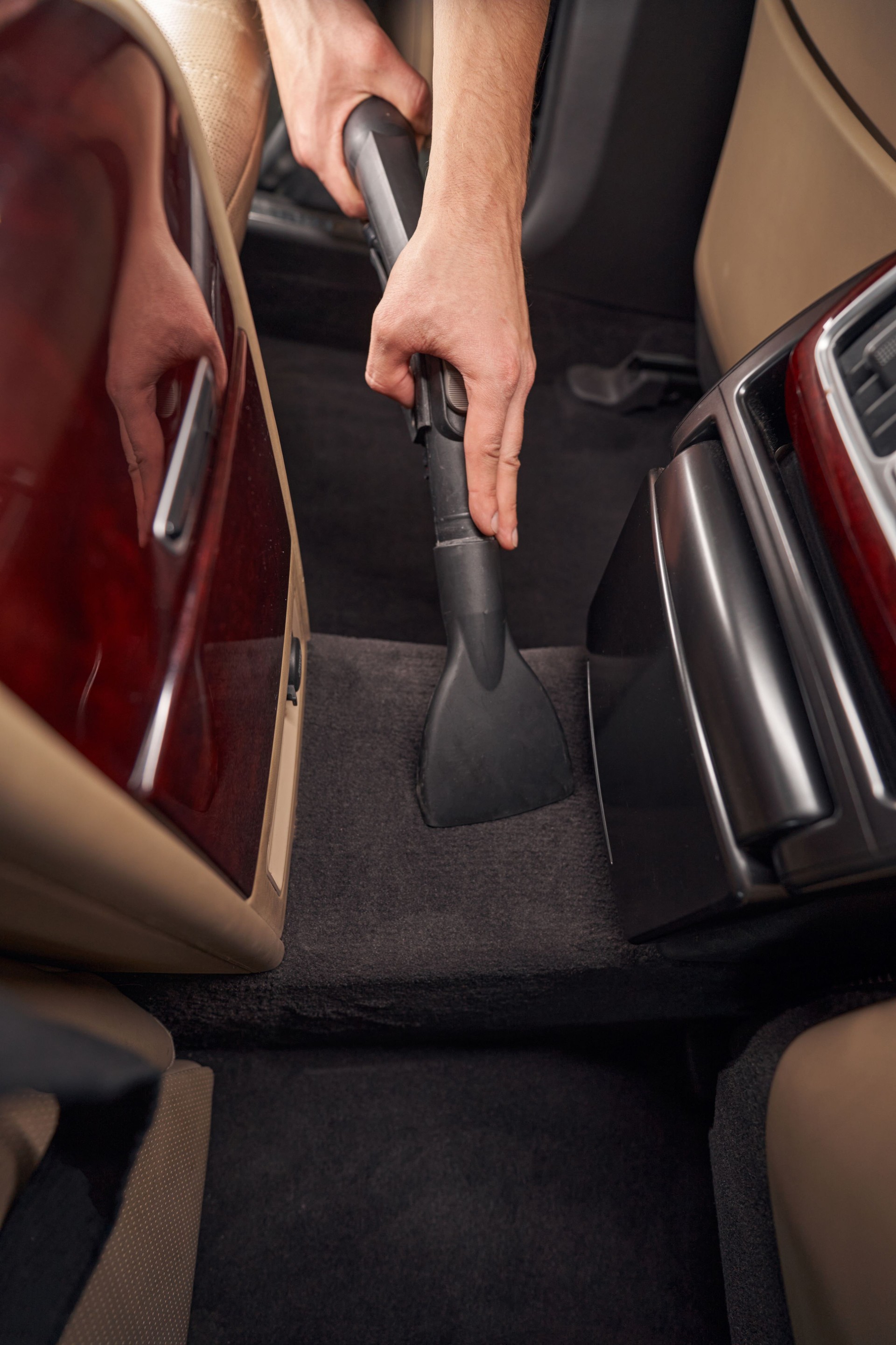 Photo of cleaning and vacuuming car interior during car detailing